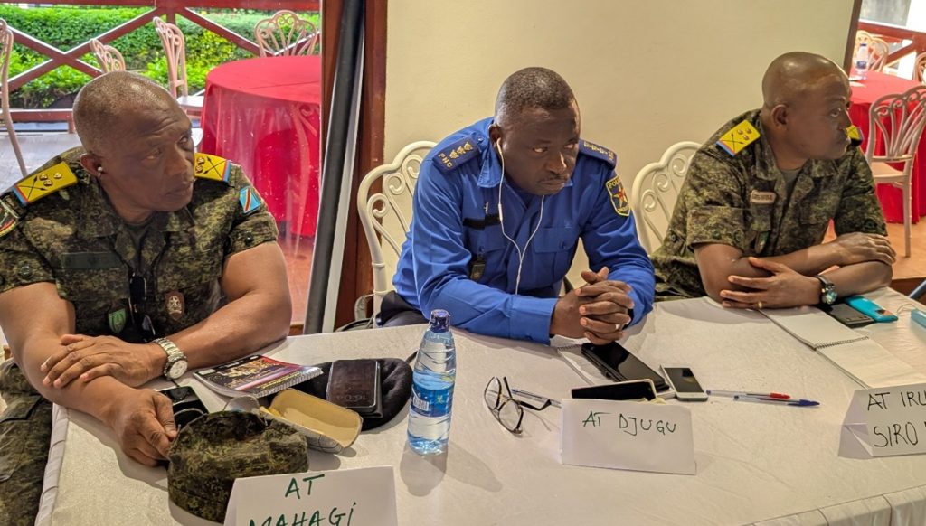 Territorial administrators of Mahagi, Djugu and Irumu seated at a Justice Plus workshop table