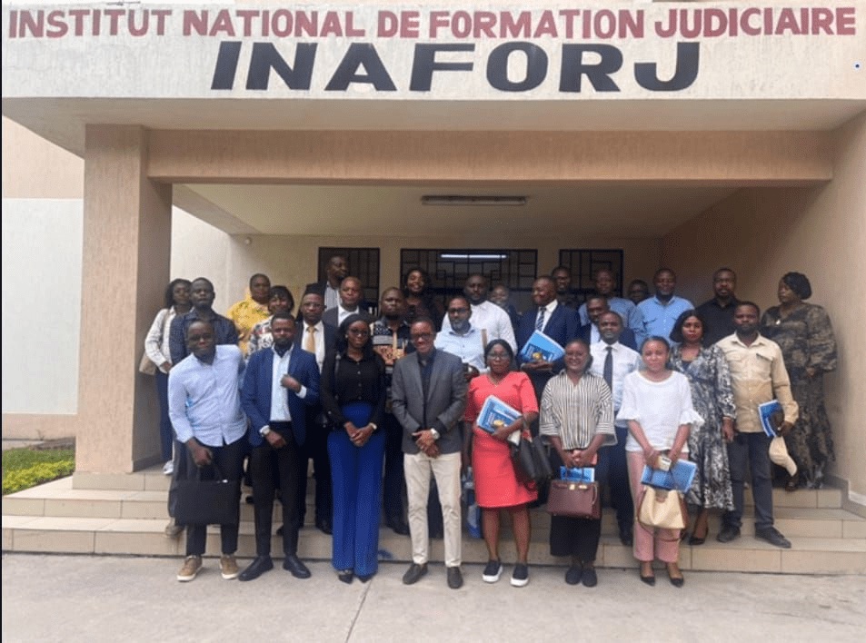 Journalists and trainers in front of the national judicial training institute after a beneficial-ownership session